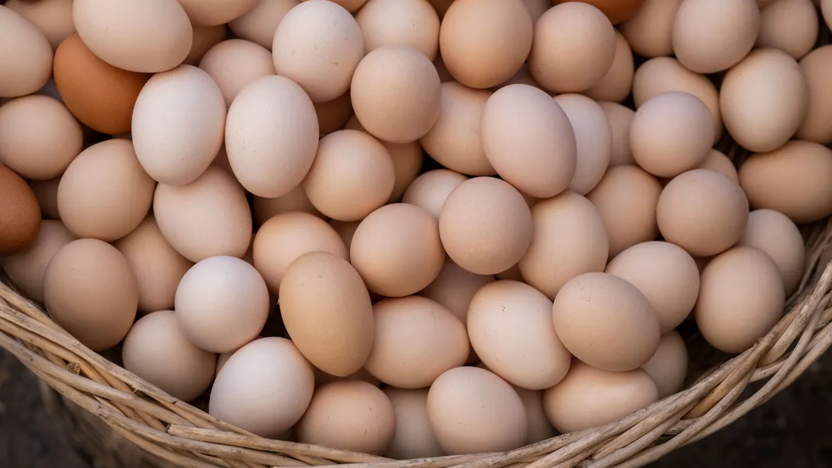 Brown eggs piled in a wicker basket