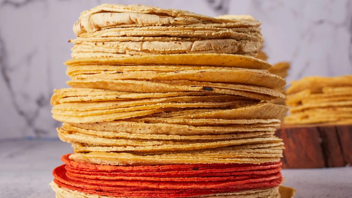 Tall stack of fresh corn tortillas