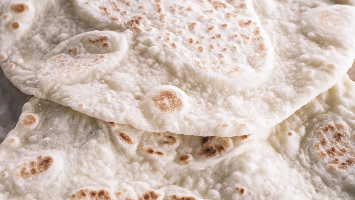 Freshly made flatbread on parchment paper