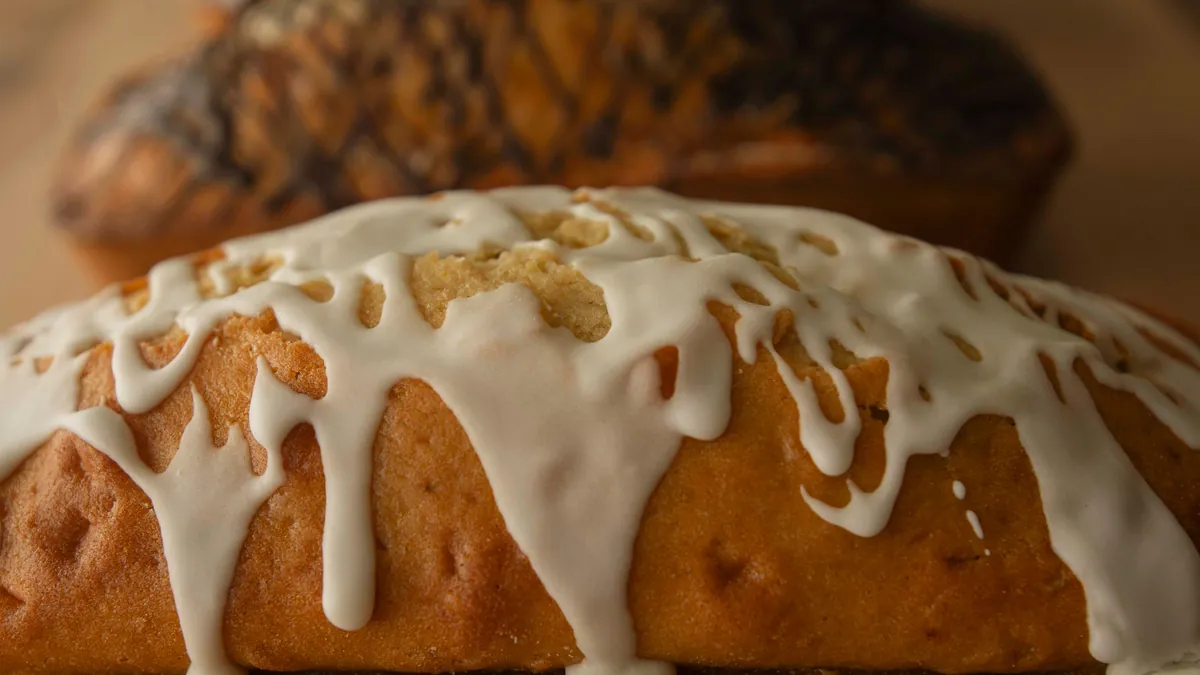 Glazed pound cake loaf with white icing dripping down the sides