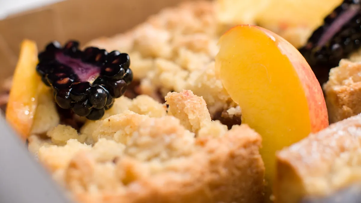 Peach and blackberry cobbler with a golden crumble topping