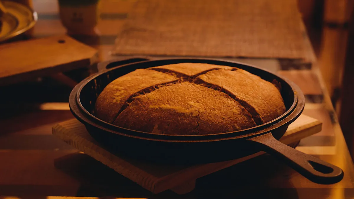 Round loaf of bread baked in a cast iron skillet