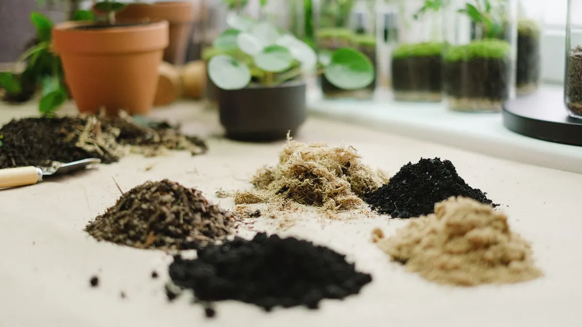 Piles of different soil types arranged on a table